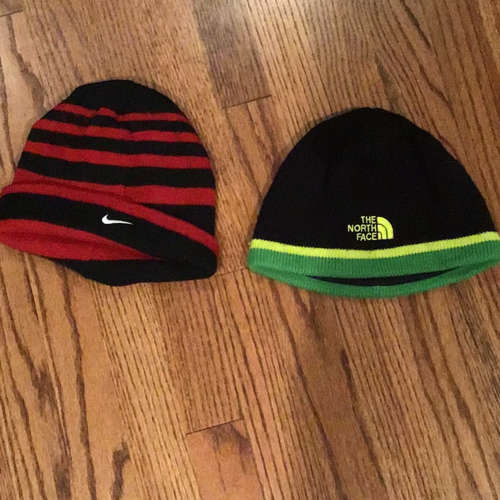 Two hats. Nike and North Face.